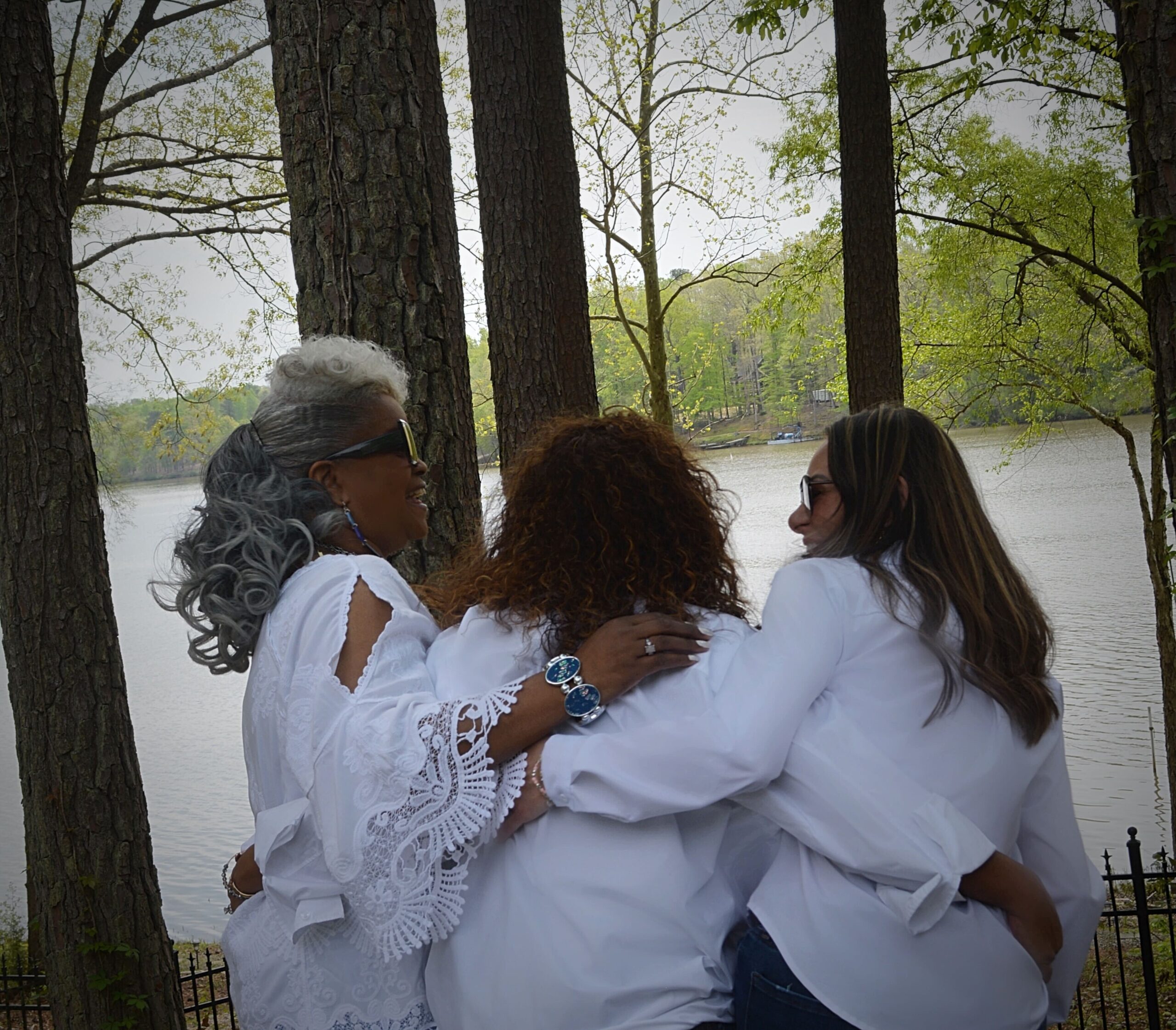 Three ladies hugging.